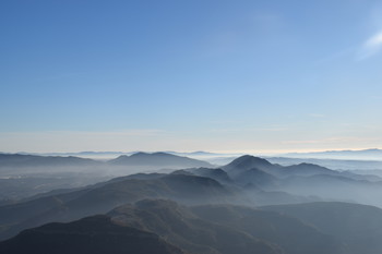 &nbsp; / view of mountains with fog from Montserrat in Spain