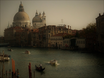 &nbsp; / The Grand Canal is the largest and most famous waterway in Venice. It serves as a vital transportation route, forming a major corridor for water traffic in the city. The canal stretches approximately 3.8 kilometers in length and varies in width from 30 to 90 meters.

The canal is lined with stunning architecture, including palaces, churches, and public buildings that showcase various styles such as Romanesque and Gothic.

Santa Maria della Salute, shown here, is a prominent Roman Catholic church and minor basilica located at the Punta della Dogana in the Dorsoduro sestiere of Venice. It is one of the most recognisable landmarks in Venice, famous for its striking dome that can be seen from various points throughout the city.

Photo by Michel Guntern, https://TravelNotes.org