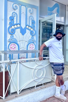 At an Art Deco cafe in Miami / A man at a Art Deco cafe in Miami, Florida