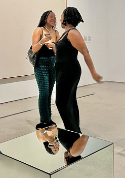 &nbsp; / Two girls talking in a museum