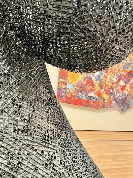 &nbsp; / Metal structure in front of a painting